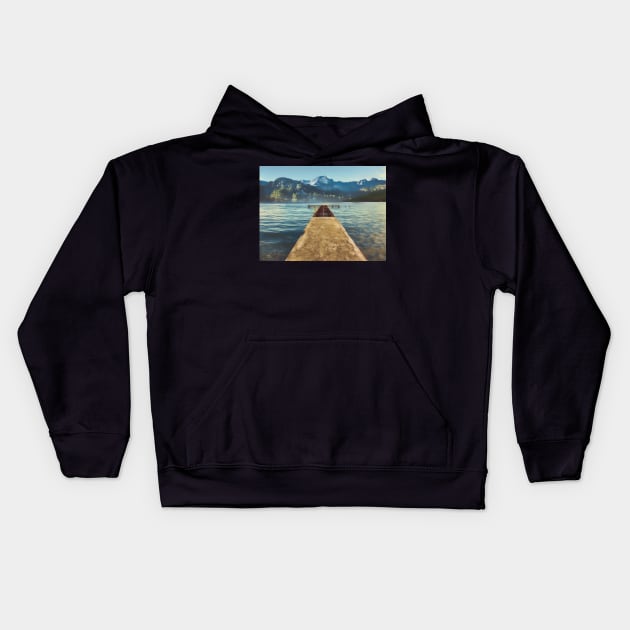 sea jetty and mountain view in winter Kids Hoodie by stuartchard